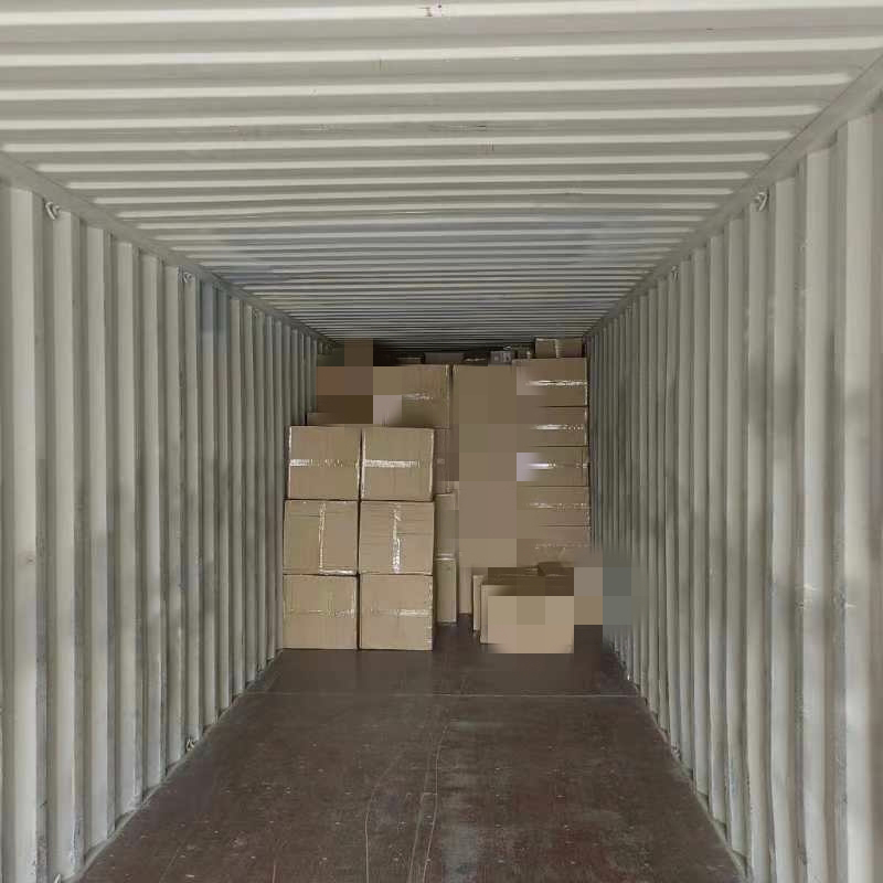 Floral packaging cartons being loaded into a shipping container