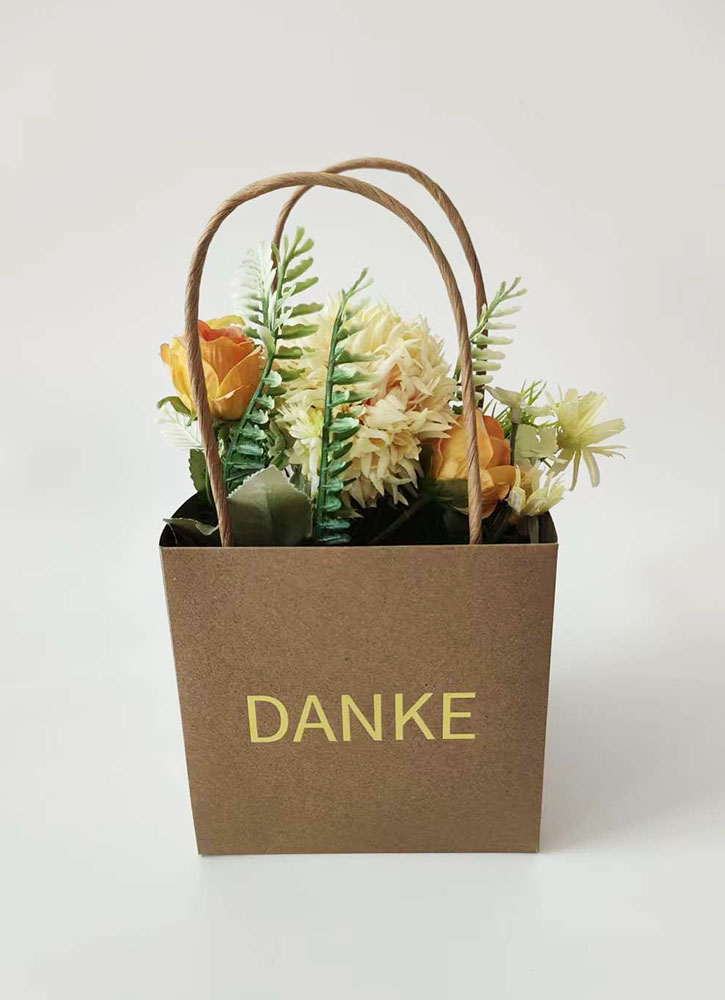 Paper flower bag with handles for floral arrangements